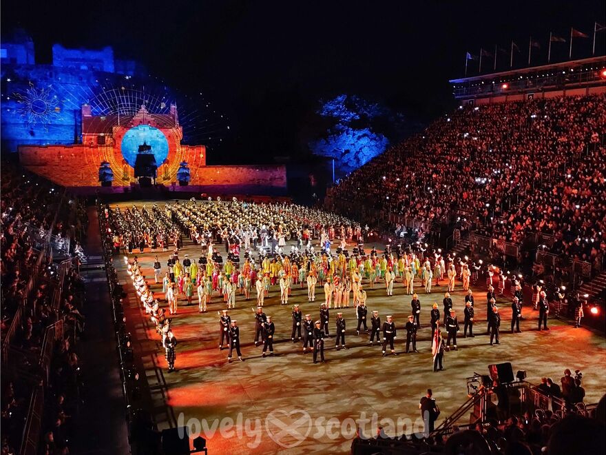 Edinburgh Military Tattoo at night on Castle Esplanade with performers and full audience