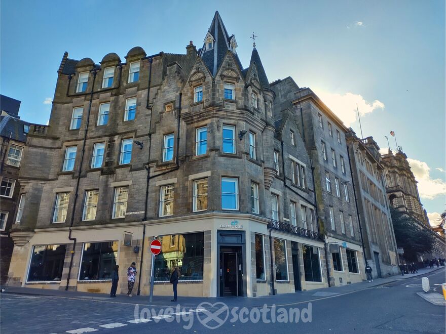 Facade of Motel One Edinburgh Royal on a sunny day in the city center