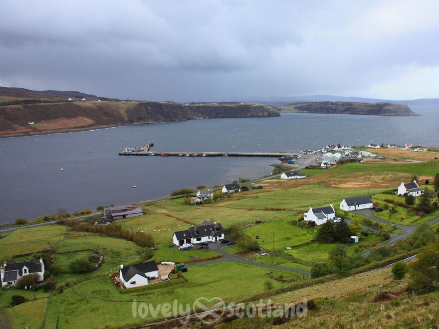 View over Uig Bay on Skye with ferry pier and scattered houses