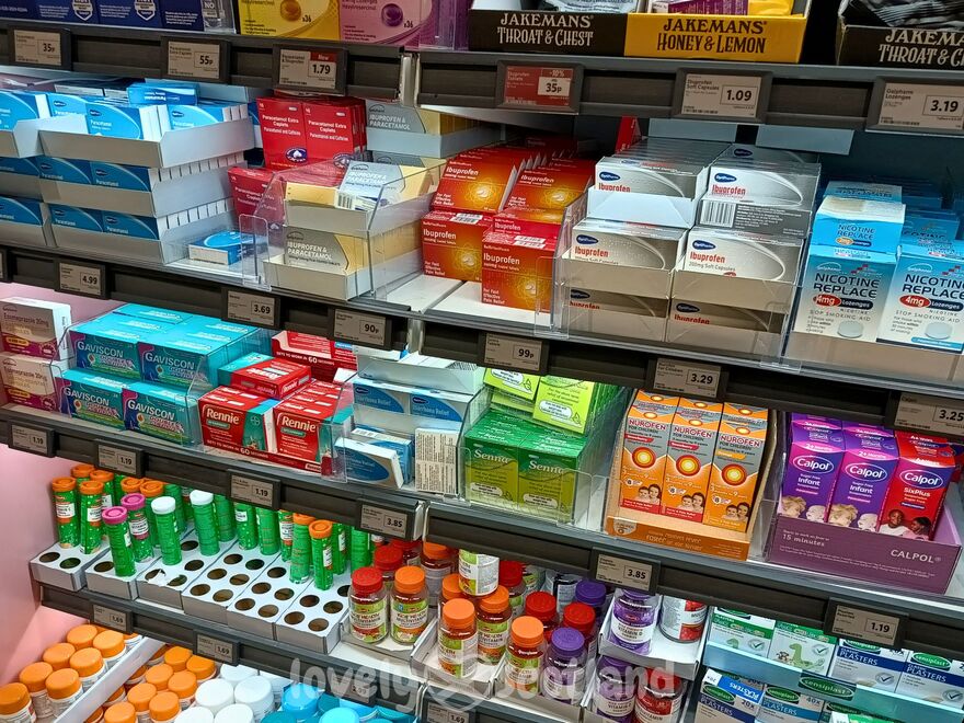 Supermarket shelf in Edinburgh with OTC medicines vitamins and personal care products