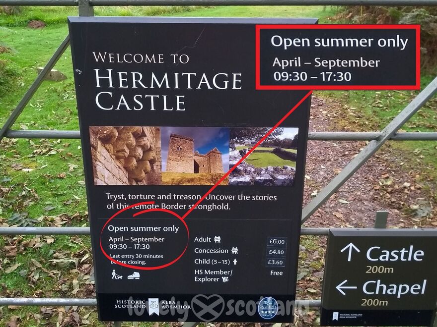 Hermitage Castle sign showing opening hours and summer only access